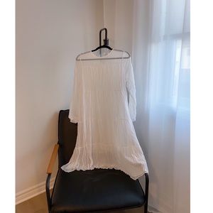 Flowy white long-sleeve dress